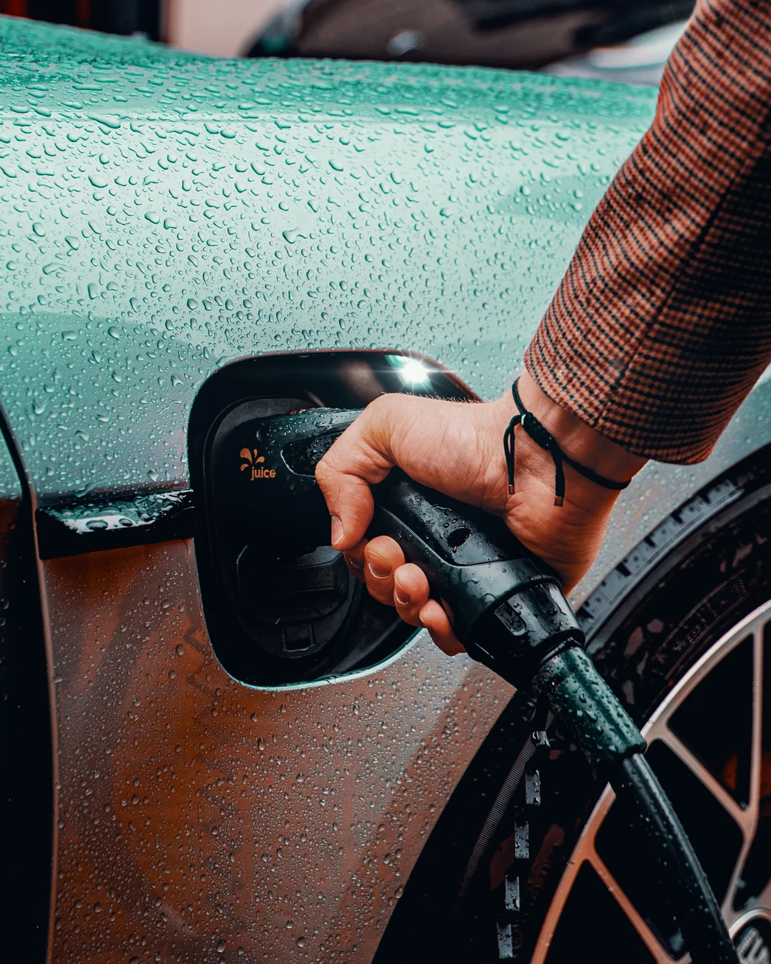 a man is recharging his car